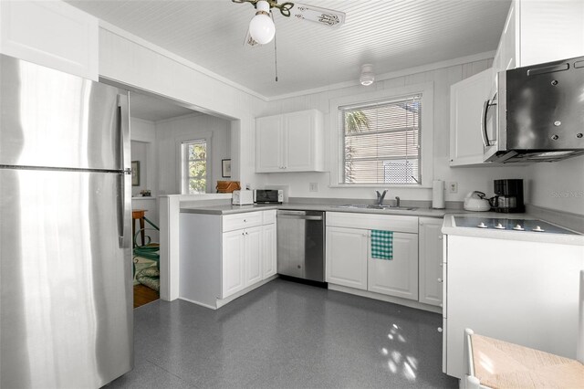 kitchen with light countertops, stainless steel appliances, a sink, ceiling fan, and white cabinets