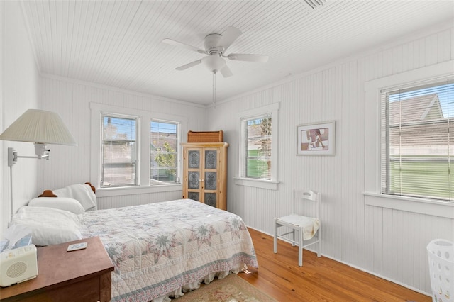 bedroom featuring ceiling fan and wood finished floors