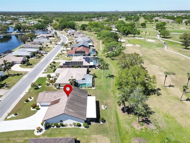 bird's eye view with a residential view, view of golf course, and a water view