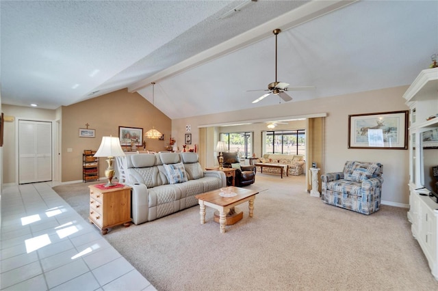 2007 E View Dr, Sun City Center, FL 33573 - living room featuring beam ceiling, a textured ceiling, light tile patterned flooring, baseboards, and ceiling fan