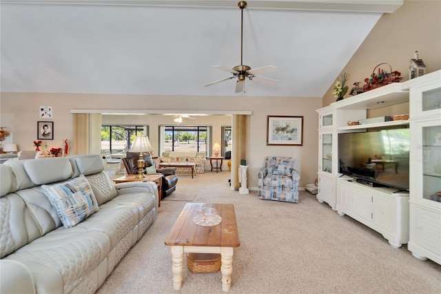 2007 E View Dr, Sun City Center, FL 33573 - living room featuring lofted ceiling with beams, light colored carpet, and ceiling fan
