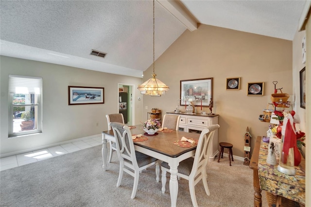2007 E View Dr, Sun City Center, FL 33573 - dining space with light carpet, beamed ceiling, a textured ceiling, and visible vents