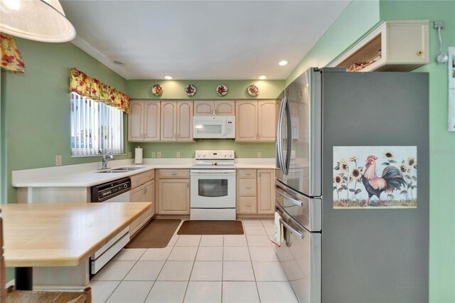 2007 E View Dr, Sun City Center, FL 33573 - kitchen featuring light countertops, light tile patterned floors, recessed lighting, white appliances, and a sink