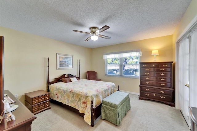2007 E View Dr, Sun City Center, FL 33573 - bedroom with light carpet, a textured ceiling, and a ceiling fan