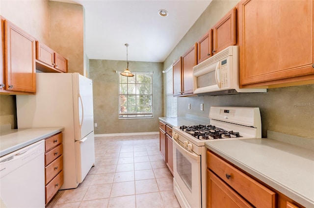 kitchen featuring decorative backsplash, light countertops, white appliances, decorative light fixtures, and light tile patterned floors