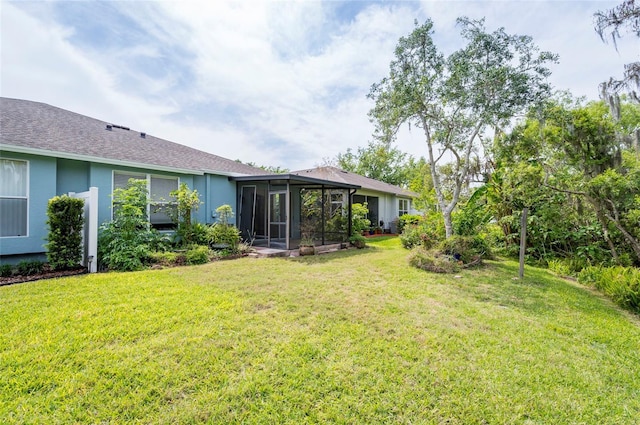 view of yard with a sunroom