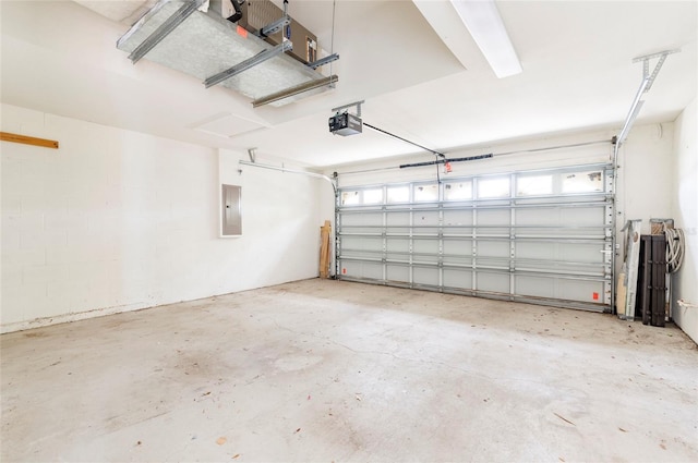 garage featuring a garage door opener and electric panel