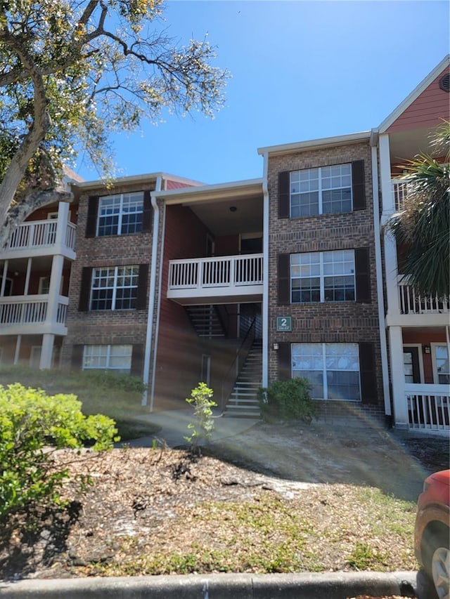 view of property featuring stairway