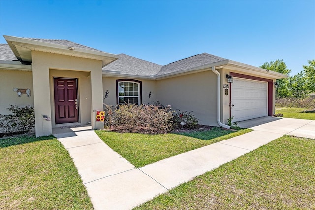 ranch-style home featuring an attached garage, stucco siding, a shingled roof, a front lawn, and concrete driveway