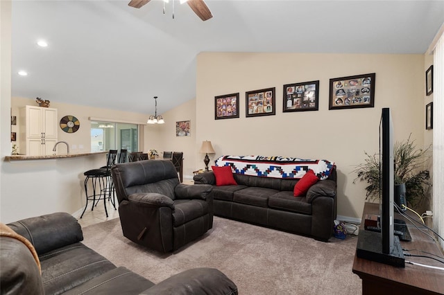 carpeted living area featuring recessed lighting, baseboards, vaulted ceiling, and ceiling fan with notable chandelier