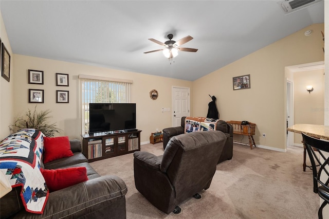 living area with visible vents, lofted ceiling, light colored carpet, and ceiling fan