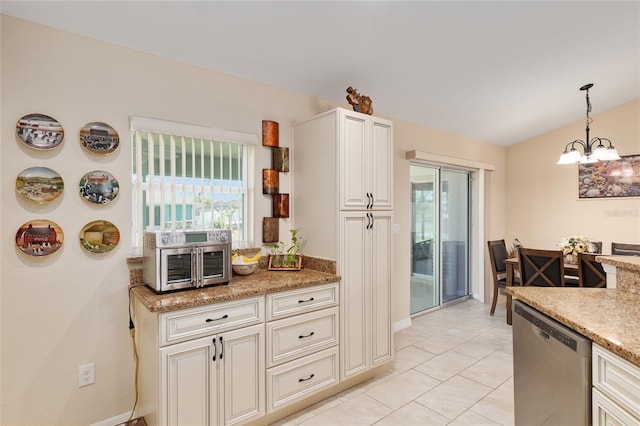 kitchen with decorative light fixtures, light tile patterned floors, light stone countertops, dishwasher, and a chandelier