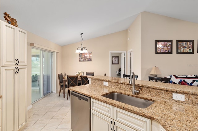 kitchen featuring pendant lighting, a sink, stainless steel dishwasher, lofted ceiling, and light stone countertops