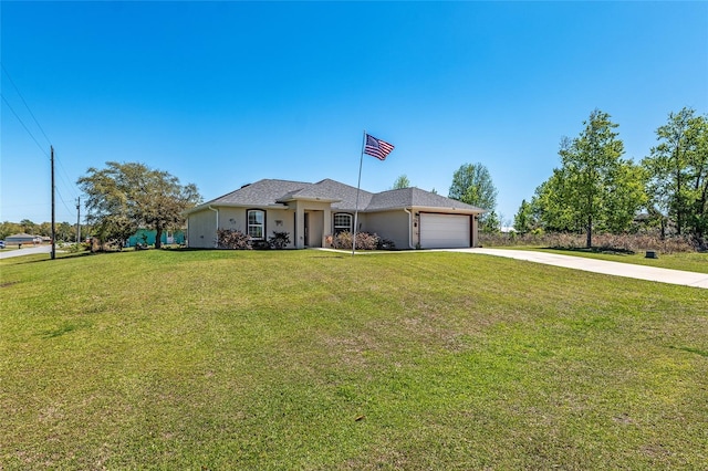 view of front of home featuring stucco siding, driveway, a front lawn, and a garage