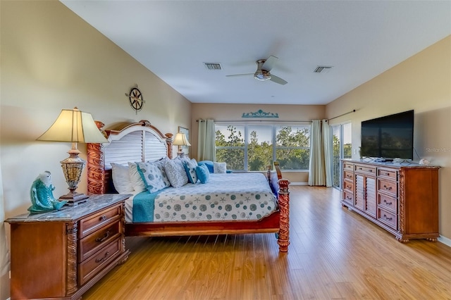 19829 Gulf Blvd Unit 601, Indian Shores, FL 33785 - bedroom featuring access to exterior, visible vents, light wood-style flooring, and a ceiling fan