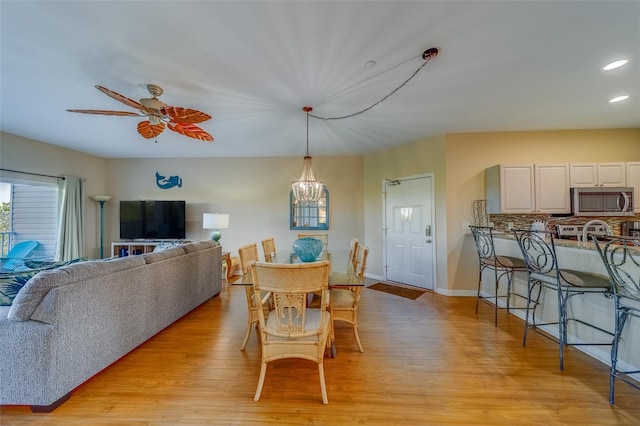 19829 Gulf Blvd Unit 601, Indian Shores, FL 33785 - dining room featuring recessed lighting, light wood-style flooring, baseboards, and a ceiling fan