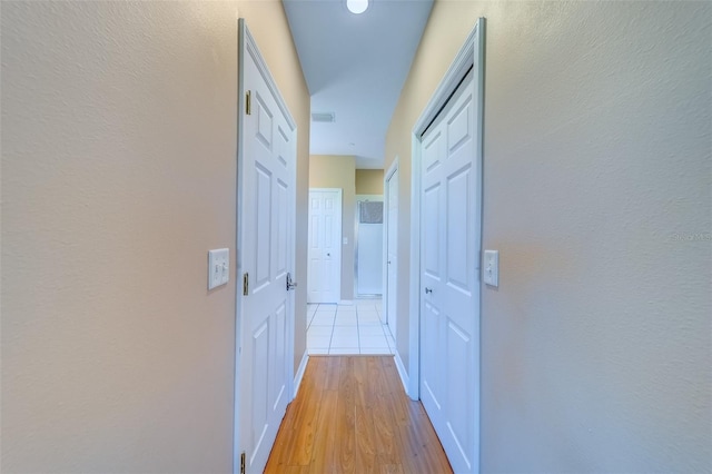 19829 Gulf Blvd Unit 601, Indian Shores, FL 33785 - corridor featuring visible vents and light wood-style flooring