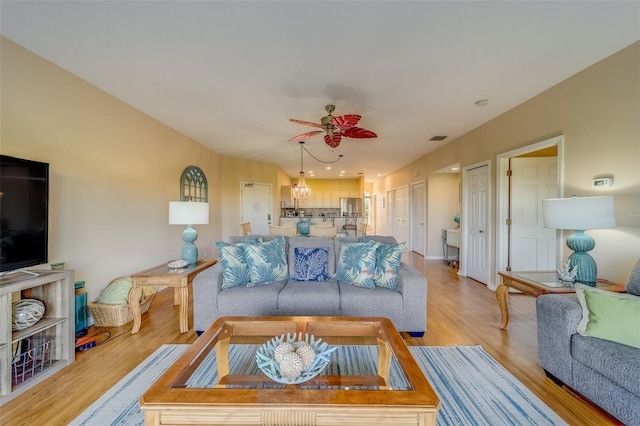 19829 Gulf Blvd Unit 601, Indian Shores, FL 33785 - living area featuring light wood-style flooring and ceiling fan