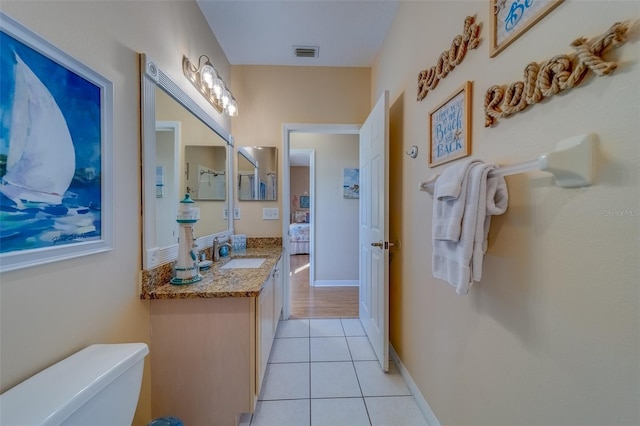 19829 Gulf Blvd Unit 601, Indian Shores, FL 33785 - bathroom featuring tile patterned floors, visible vents, toilet, baseboards, and vanity