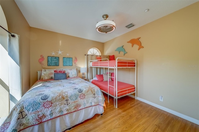 19829 Gulf Blvd Unit 601, Indian Shores, FL 33785 - bedroom with ceiling fan, visible vents, baseboards, and wood finished floors