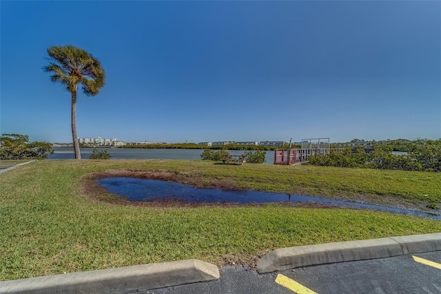19829 Gulf Blvd Unit 601, Indian Shores, FL 33785 - view of community featuring a lawn and a water view