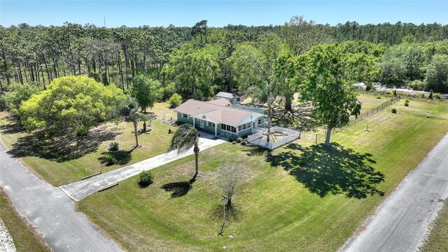 aerial view featuring a view of trees