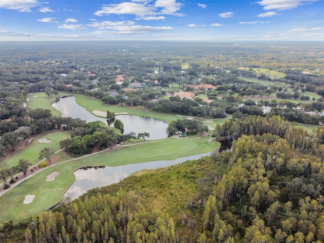 bird's eye view featuring golf course view, a forest view, and a water view