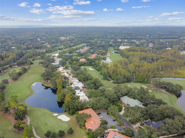 bird's eye view featuring golf course view, a forest view, and a water view
