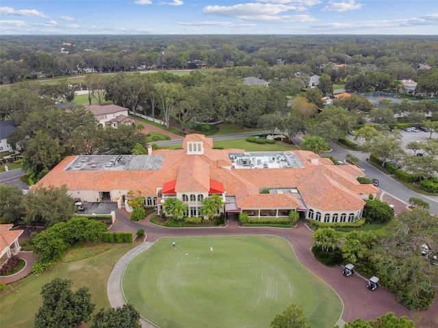 birds eye view of property with view of golf course