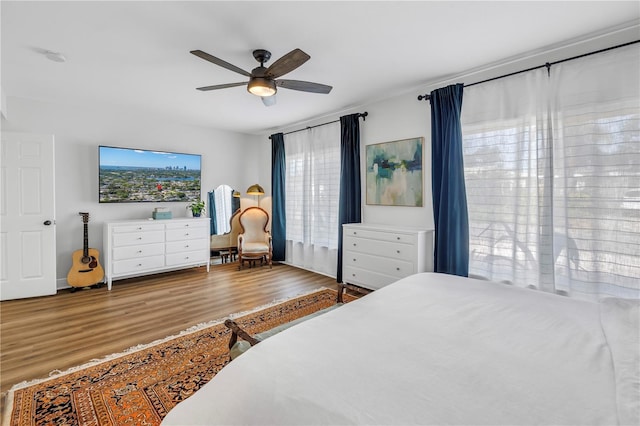 bedroom featuring a ceiling fan and wood finished floors