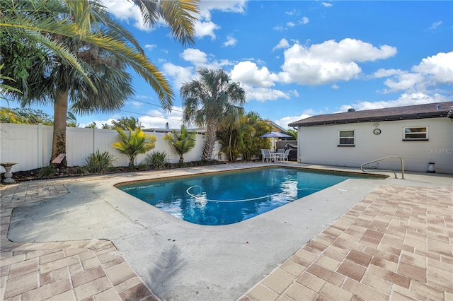 view of pool with a patio, a fenced in pool, and a fenced backyard