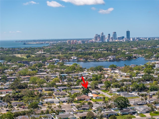 birds eye view of property with a city view and a water view