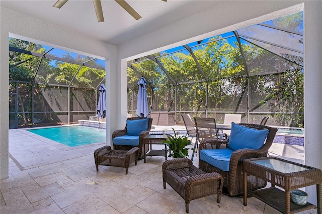 outdoor pool with an outdoor hangout area, a lanai, a ceiling fan, and a patio area