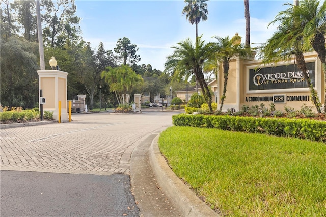 exterior space with a gated entry and curbs