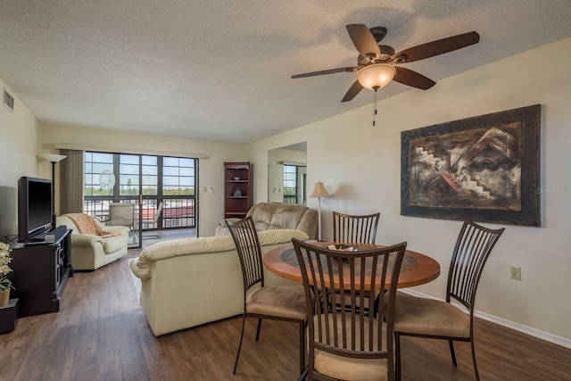 9860 62nd Ter N Unit 1051, Saint Petersburg, FL 33708 - dining space featuring a ceiling fan, wood finished floors, a textured ceiling, baseboards, and visible vents
