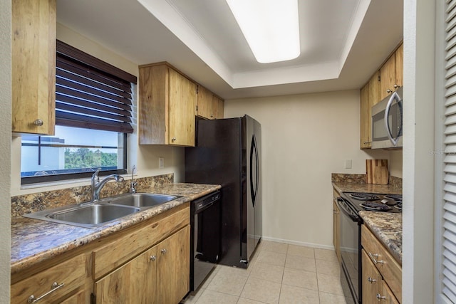9860 62nd Ter N Unit 1051, Saint Petersburg, FL 33708 - kitchen with baseboards, a sink, a tray ceiling, black appliances, and light tile patterned floors