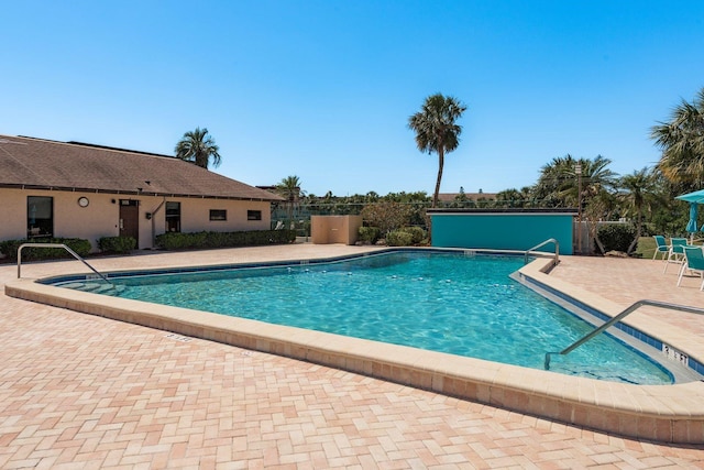 9860 62nd Ter N Unit 1051, Saint Petersburg, FL 33708 - pool featuring fence and a patio area