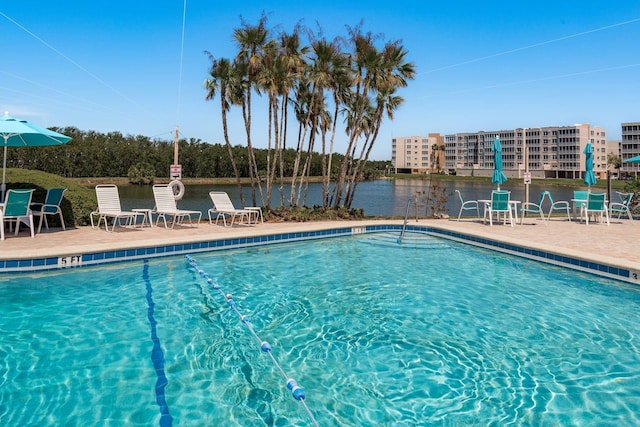 9860 62nd Ter N Unit 1051, Saint Petersburg, FL 33708 - community pool with a patio area