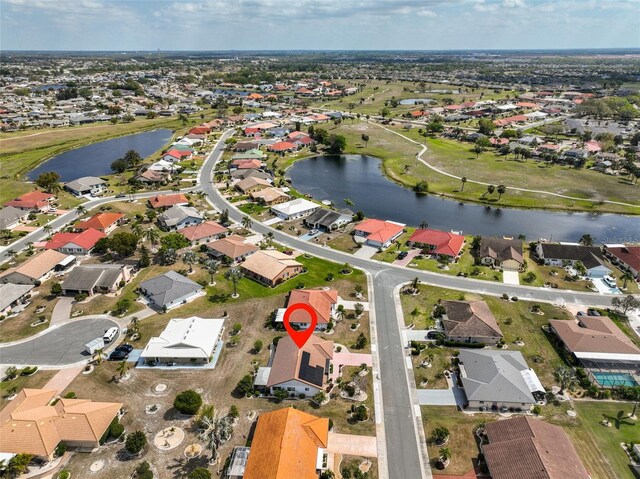 aerial view featuring a residential view and a water view