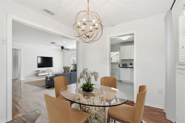 1401 E N St, Tampa, FL 33604 - dining area featuring hardwood / wood-style floors, a ceiling fan, and a chandelier
