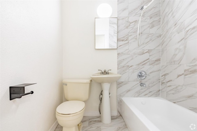 bathroom with baseboards, marble finish floor, toilet, and shower / tub combination