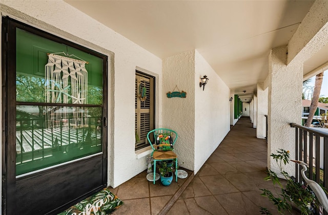 view of exterior entry with stucco siding