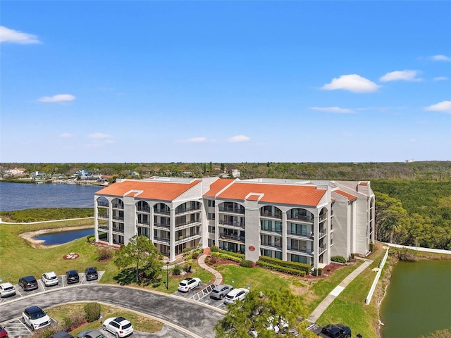 birds eye view of property with a water view