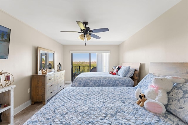 bedroom featuring baseboards, ceiling fan, access to outside, and light wood-style floors
