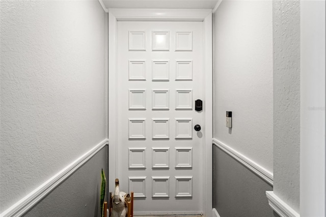 entryway with a textured wall