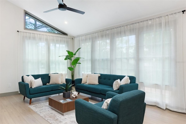 1320 Coral Way S, Saint Petersburg, FL 33705 - living area with light wood finished floors, ceiling fan, and vaulted ceiling