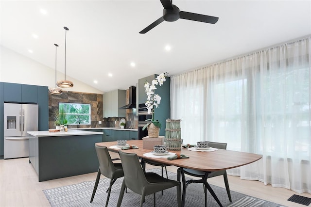 1320 Coral Way S, Saint Petersburg, FL 33705 - dining room featuring ceiling fan, light wood-style flooring, recessed lighting, and high vaulted ceiling