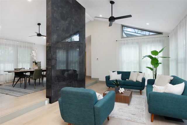 1320 Coral Way S, Saint Petersburg, FL 33705 - living room featuring a ceiling fan, wood finished floors, healthy amount of natural light, high vaulted ceiling, and beamed ceiling