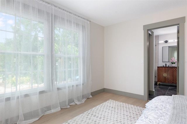 1320 Coral Way S, Saint Petersburg, FL 33705 - bedroom featuring light wood-style flooring and baseboards