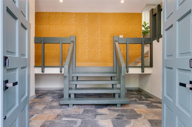 1320 Coral Way S, Saint Petersburg, FL 33705 - stairs featuring an accent wall, recessed lighting, and stone finish floors